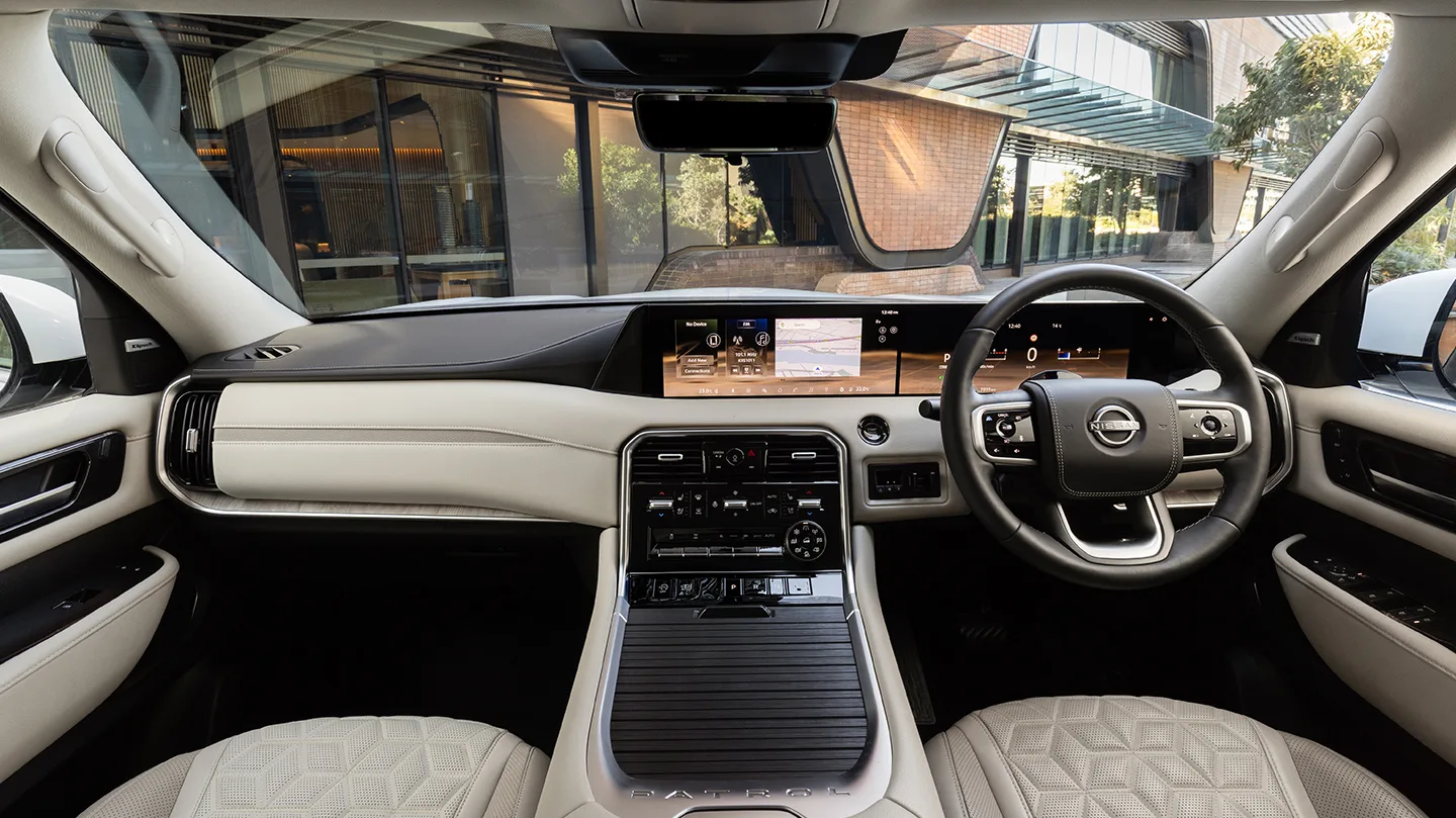 Nissan Patrol Y63 dashboard with dual widescreen displays