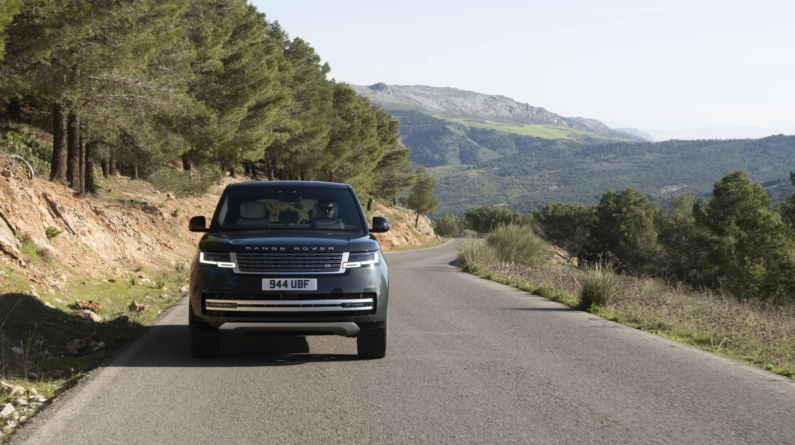 The Range Rover Electric photographed head-on while driving on a mountain road